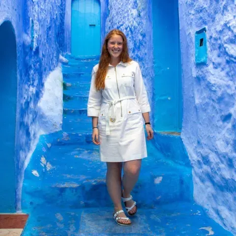 Rebecca Kryceski stands in the blue city of Chefchaouen